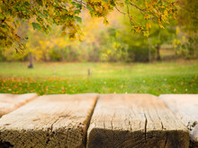 A Simple Wooden Table Against The Backdrop Of A Beautiful Autumn Nature. Outdoor Recreation, Healthy Lifestyle, Thanksgiving, Harvest Day Celebration, Family Vacation, Romance, Solitude.