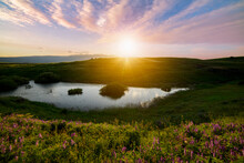 Beautiful Panoramic Landscape Sunset Over The River And Hills.