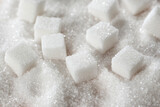 Fototapeta  - White sugar cubes to use as a background. Refined cane sugar