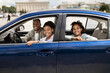 © Prostock-studio - Happy Black Family Sitting In New Blue Car In City