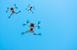 Consumer drones with camera hovering against sky