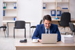 © Elnur - Young male employee and too much work in the office