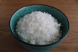 Fototapeta  - bowl of rice on black background