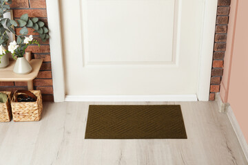 Sticker - Dark olive door mat on wooden floor in hall