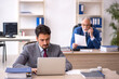 © Elnur - Two male colleagues working in the office
