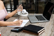 © ArLawKa - Businessman working in the office with the laptop on desk, financial accounting concept.