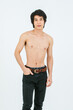 © Bangkok Click Studio - Portrait isolated cutout studio shot of Asian young handsome confident slim thin muscular shirtless teenager male model standing posing holding hand in denim jeans pants pocket on white background
