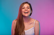 © Yuriy Shevtsov - Happy woman face portrait with neon lights colors effect. Smiling girl mouth open isolated on neon multicolored background