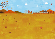 秋の山と草原と電車の景色