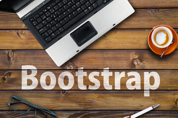Wall Mural - bootstrap css framework . word bootstrap on wooden desk and laptop