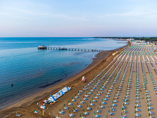 Sunrise in Lignano Sabbiadoro seen from above. From the sea to the lagoon, the city of holidays