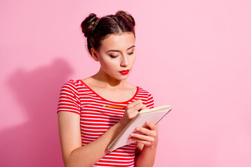 Poster - Portrait of calm focused smart person hold notepad pencil take notes isolated on pink color background