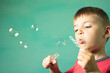 © vandame - child blows soap bubbles