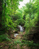 Fototapeta Las - beautiful emerald waterfalls green forest mountains guiding for backpacker Thailand destinations backpacking camping relaxing hiking at Huai Mae Khamin waterfall national park, Kanchanaburi.