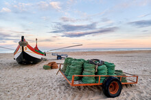 Nets And Colorful Fishing Boats On The Sand, Along The Atlantic, On The Beach Of Torreira, Portugal