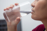 Fototapeta Łazienka - woman drinking water close up
