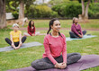 © Sabrina - Group of diverse women doing yoga exercise at city park