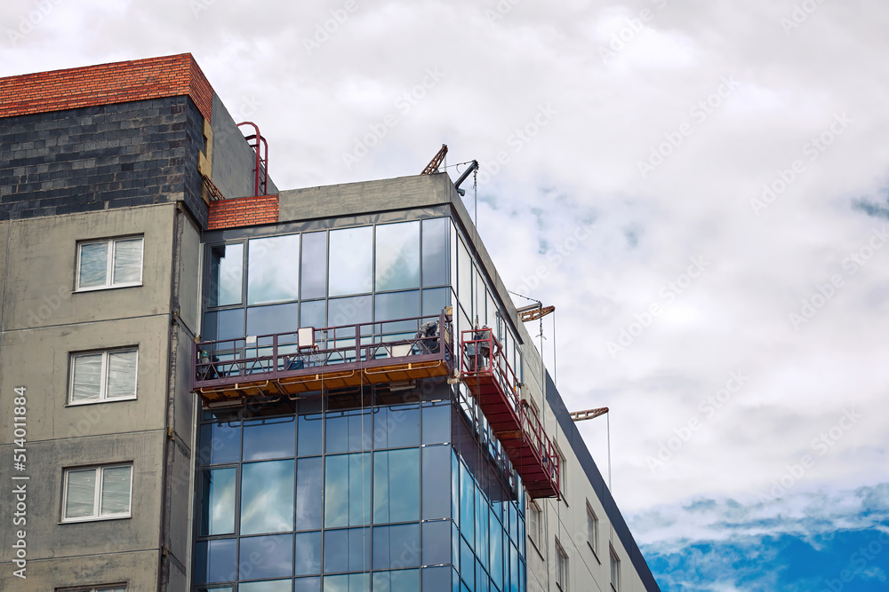 Suspended platform, construction craddle hanging on building ...