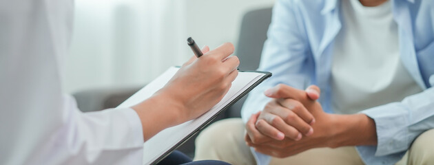 men talk with a psychologist during talking therapy stressed mental health at office