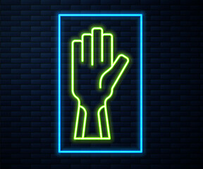 Sticker - Glowing neon line Protective gloves icon isolated on brick wall background. Vector