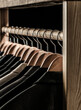 Mens shirts, suit hanging on rack. Hangers with jackets on them in boutique. Suits for men hanging on the rack. Mens suits in different colors hanging on hanger in a retail clothes store, close-up