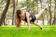 © platinumArt - Young beautiful woman wearing sportive clothes on city park, outdoors woman doing push ups with one leg up. Outdoor sports, healthy life concepts.