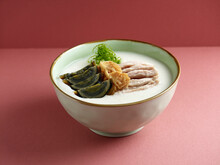 Century Egg And Shredded Pork Congee Served In A Dish Isolated On Mat Side View On Grey Background