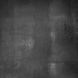 Abstract empty grungy wall background in black and grey colors. Granite or chalkboard texture in dark tones.