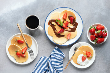 Wall Mural - Breakfast pancakes with strawberries and cream