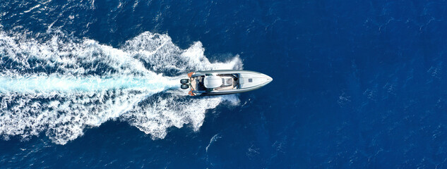 Wall Mural - Aerial drone photo of luxury inflatable rib speed boat cruising in mediterranean deep blue sea