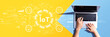 © Tierney - IoT theme with person using a laptop computer