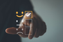 Customer Service And Satisfaction Concept, Businessman Are Touching The Virtual Screen On The Happy Smiley Face Icon To Give Satisfaction In Service.
