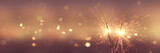 Fototapeta Sypialnia - Happy New Year background with glowing sparklers.