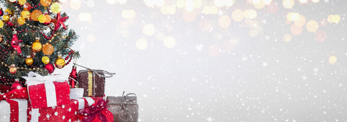 christmas tree with decoration on a winter background.