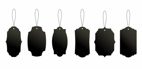 Set of black price or luggage tags of vintage shapes with rope.