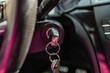 Key inserted into the lock of ignition of the car.Car ignition key.Car key in the ignition. Black key in the lock ignition close-up. Modern car.Selective focus.