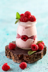 Wall Mural - Berry yogurt with fresh raspberries and mint.