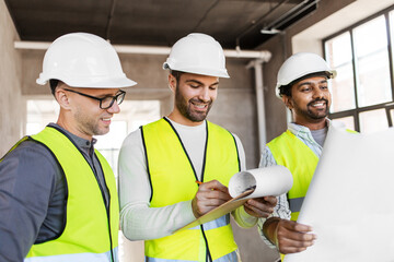 Sticker - architecture, construction business and people concept - male architects in helmets with clipboard discussing blueprint in office building