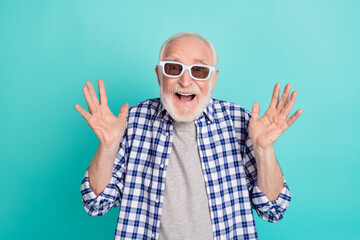 Poster - Photo of senior grandfather watching funny movie wearing 3d spectacles isolated on turquoise color background