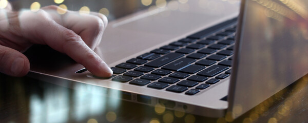 Wall Mural - finger on laptop business background