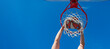 © Olena - happy man with basketball ball on court. professional basketball player training outdoor. Horizontal poster design. Web banner header, copy space.