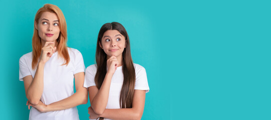 Wall Mural - Mother and daughter child banner, copy space, isolated background. pondering mother and child with straight hair in white shirts, ponder.