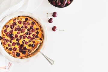 Wall Mural - Plate with tasty cherry cheesecake pie on white background. Top view. Copy space