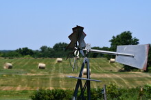Windmill And Hay Field
