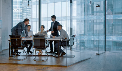 Teamwork: young business people discussing holding a presentation in modern office