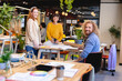 © Wavebreak Media - Portrait of smiling creative businessman and businesswomen at desk in office