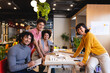 © Wavebreak Media - Portrait of smiling multiracial male and female architects with architectural model in office
