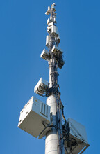 Telecommunication Cell Tower Antenna Against Blue Sky. Wireless Communication And Modern Mobile Internet. Bottom View.