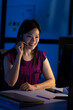© Wavebreak Media - Asian female customer representative talking over headset and using computer at desk in office
