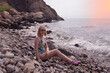 © Наталья Жукова - young girl  sits on the beach in summer